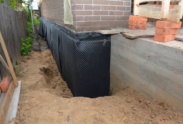 Happy homeowners after waterproofing job in Twin Lake